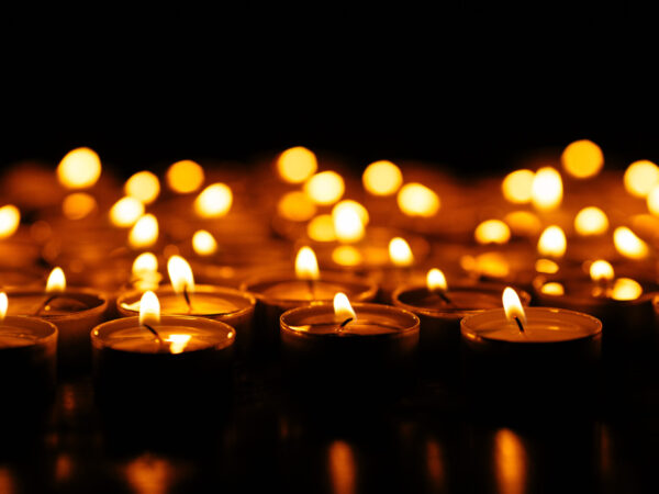 Candles. Set of lighting candles in dark. Selective focus